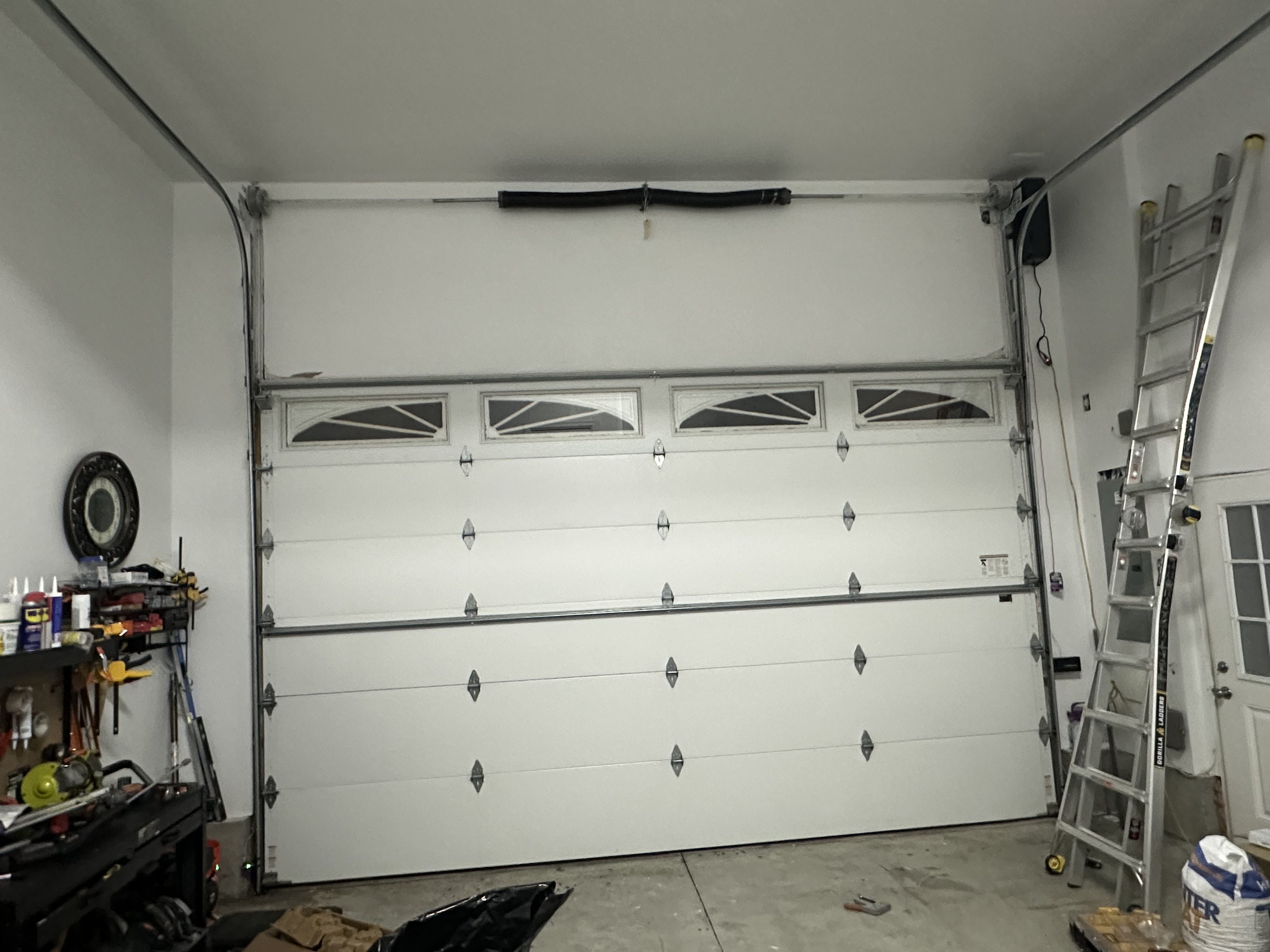 Residential garage door installation with decorative windows
